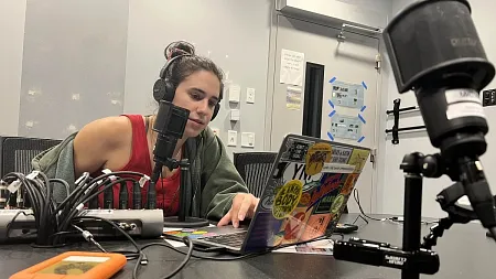 an undergrad recording a podcast