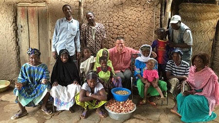 Stephen Wooten poses with a family in Mali