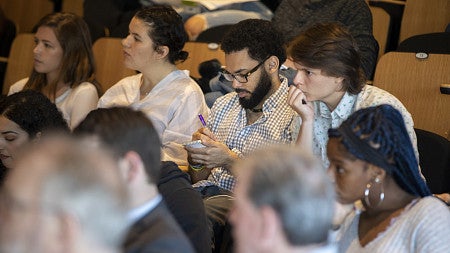 close up shot of a group of people in attendance at a speaking event