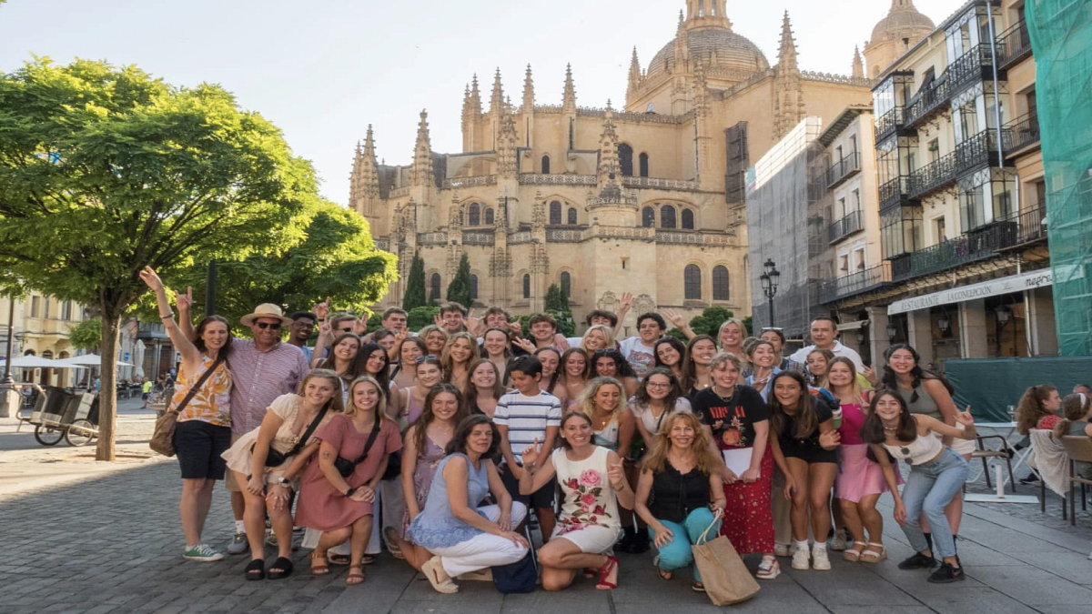 group of students posing in a European city