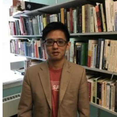 Roy Chan in a library