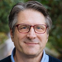 A portrait of Ross King.