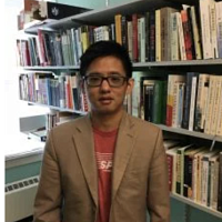 Roy Chan in a library